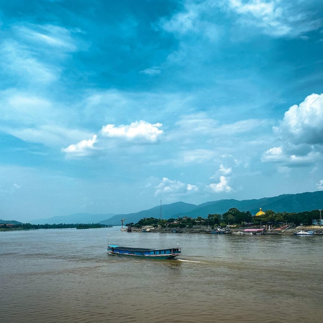 decorative image of a boat on the Mekong River
